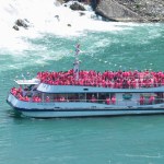 Niagara Falls Town, ON, Canada - May 30, 2015: Tourists aboard the cruise boat take a closer look at the Niagara Falls