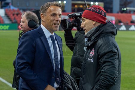 Photo for Toronto, ON, Canada - Match 18, 2023:     Head coach of the Inter Maimi FC Phil Neville  (L) greats Head Coach and Sporting Director of the Toronto FC Bob Bradley (R) before  the match between Toronto FC (Canada) and Inter Miami FC (USA) at BMO Field - Royalty Free Image