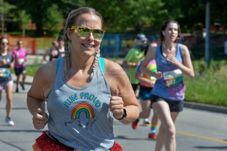 Photo for Toronto, ON, Canada - June 22, 2019: Runner takes part in amateur sports run competition during the Pride month in Toronto - Royalty Free Image
