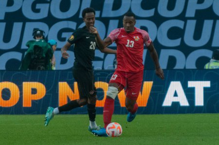 Toronto, ON, Canada - June 27, 2023: Cdric Avinel #13 runs for the ball during the  2023 Concacaf Gold Cup match between national team of Canada and Guadeloupe (Group D) (Score 2:2).