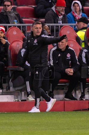 Photo for Toronto, ON, Canada - April 20, 2024: Head Coach of the Toronto FC John Herdman looks at the field during the MLS Regular Season match between Toronto FC (Canada) and New England Revolution (USA) at BMO Field - Royalty Free Image