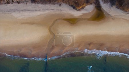 Drone perspective: Deserted shoreline, golden hour glow.