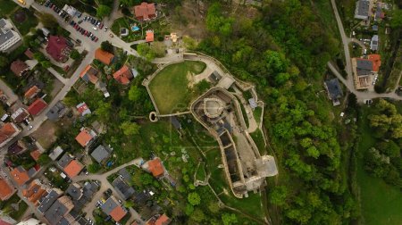 Drone view reveals the ancient Bolkow Castle nestled in Dolnolaskie, Poland.