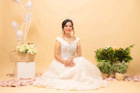 Photo for Elegant woman pose sitting formal relaxed cheerful looking forward her stairs leaning on each other wearing beautiful dresses indoor photo shot. single wedding national bride studio - Royalty Free Image