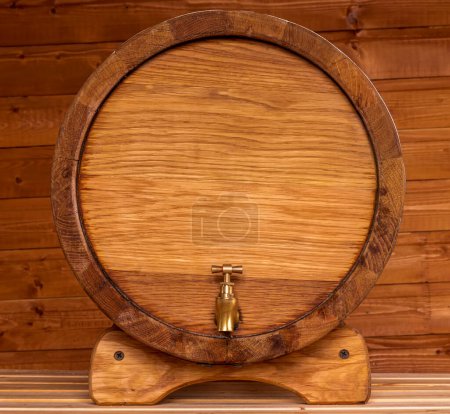 Photo for Wooden oaken barrel for cellar on a ginger wood backgroung , beer kask with copyspace close up , vine vat of oak - Royalty Free Image