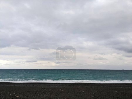Photo for Hualien, Taiwan - 11.26.2022: Qixingtan Beach with no people facing the wavy Pacific Ocean on a stormy day under clouds during the pandemic - Royalty Free Image
