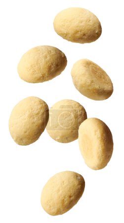 Photo for Ghee biscuits or cookies falling isolated on white background, close-up view of homemade melt in mouth nei biscuits, eggless cookies are made whole wheat flour - Royalty Free Image
