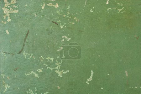 abstract of old worn book cover background, historical and vintage faded green hue or torn, weathered texture wallpaper or backdrop for graphic design, blank space for text