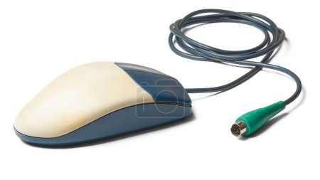 old computer mouse with ps/2 connector or port, two button early mouse which used rubber balls on the underside to track movement, isolated on white background
