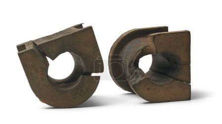 used broken vehicle stabilizer rubber bushings, dirty worn-out car parts isolated white background with shadows, repair and maintenance concept