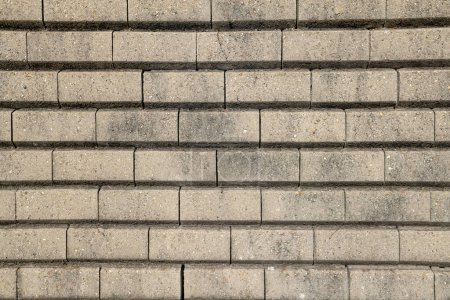 Foto de Paredes de piedra seca, detalle de construcción de paredes prefabricadas en bloques de hormigón de gravedad, muro de contención en bloques de hormigón. bloques autoportantes textura frontal - Imagen libre de derechos