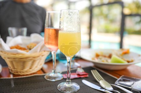 Photo for Alcohol in the morning on vacation symbolizes relaxation, indulgence, and celebration. It represents a break from routine, a time to unwind and enjoy life. It can also suggest a desire to escape - Royalty Free Image