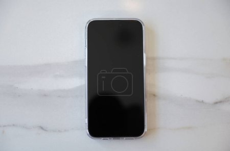 An empty black phone screen mock-up symbolizes the potential for disconnection and addiction to technology, highlighting the need for balance and mindfulness in our relationship with digital devices