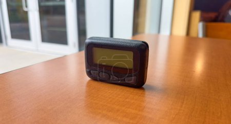 Hospital work pager and technology symbolize efficient communication and coordination between medical professionals, ensuring timely and effective patient care