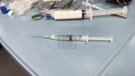 Photo for Hospital medications, fentanyl, propofol, intravenous fluids, drugs, syringes, and needles symbolize healthcare, treatment, and medical interventions - Royalty Free Image