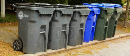 Photo for Trashcans symbolize waste management, cleanliness, responsible disposal, and the importance of maintaining a tidy and hygienic environment - Royalty Free Image