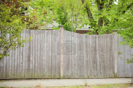 Photo for Wooden fence represents boundaries, security, privacy, natural beauty, rustic charm, and a connection to nature - Royalty Free Image