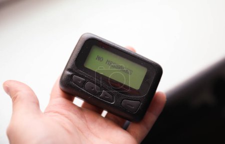 Photo for Symbolic of efficient and discreet business communication, the pager beeper represents instant messaging and the fast-paced nature of corporate world - Royalty Free Image