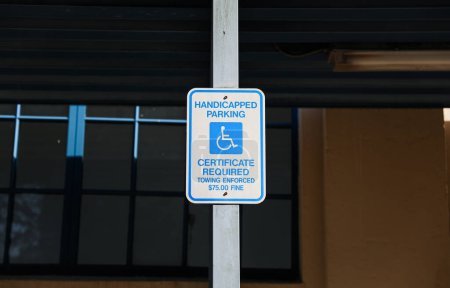 Photo for Handicap sign represents inclusivity, equal rights, and support for individuals with disabilities. Its blue and white sign denotes accessibility and serves as a reminder to create an inclusive society - Royalty Free Image
