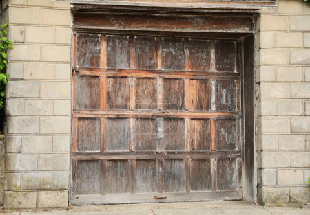 Photo for A closed garage door, symbolizing privacy, security, and a barrier between the outside world and personal space - Royalty Free Image