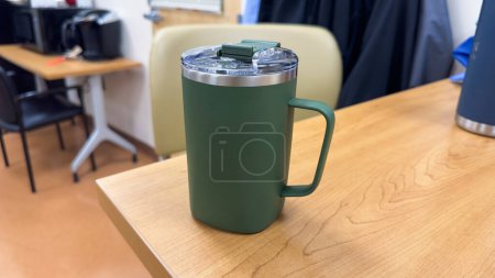 Photo for "Symbolic and versatile, a reusable mug signifies sustainability and eco-consciousness. It represents a shift towards reducing waste and embracing a greener lifestyle - Royalty Free Image