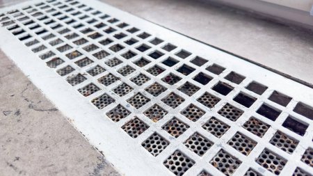 Photo for Air vents, symbolizing the circulation of fresh air and the importance of ventilation for a healthy and comfortable environment. The metallic grates represent the interconnectedness of spaces - Royalty Free Image