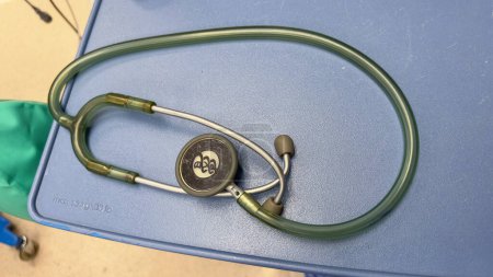 Photo for Stethoscope lying on a medical report, representing the vital connection between healthcare professionals and patient well-being - Royalty Free Image