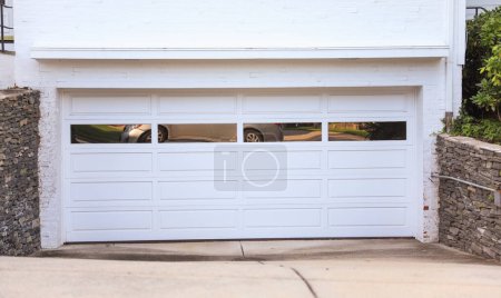 white door of a garage with white garage door