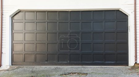 Photo for Garage door with a white brick door - Royalty Free Image