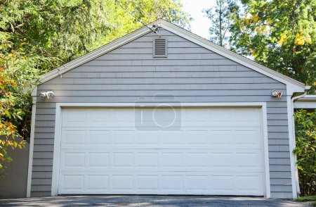 white garage house with garage