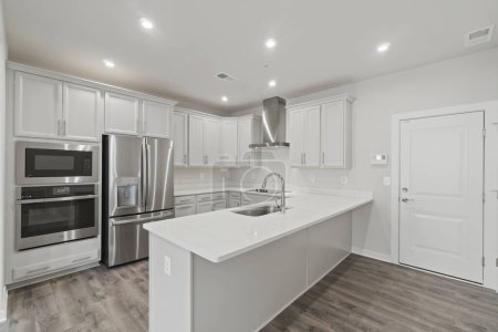 Foto de Modern kitchen with white walls and wooden floor. 3d rendering - Imagen libre de derechos