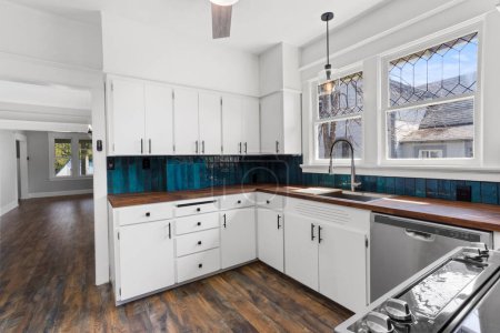 Téléchargez les photos : Modern kitchen with white walls and wooden floor. 3d rendering - en image libre de droit