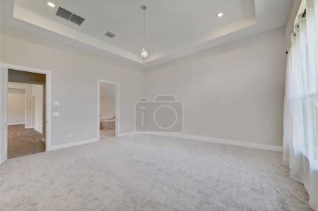 Photo for Empty and unfurnished brand new apartment, large empty bedroom with white walls, large bright windows. Nobody inside. California, USA - 2023 - Royalty Free Image