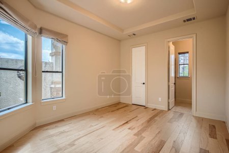 Photo for Empty and unfurnished brand new apartment, large, airy, empty room with white walls, and wooden floors. Nobody inside. USA - Royalty Free Image