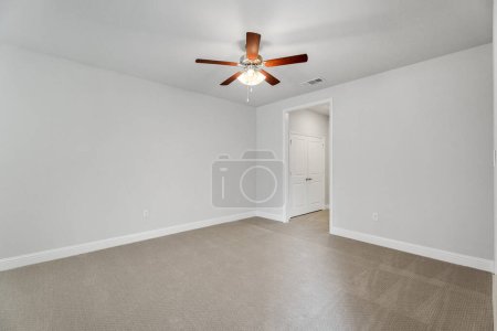 Photo for Empty and unfurnished brand new apartment, large empty bedroom with white walls, large bright windows. Nobody inside. USA - Royalty Free Image