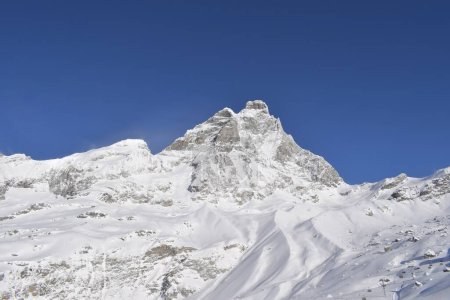 Photo for Beautiful snowcapped Matterhorn from ski slopes in Cervinia Valtournenche ski resort, Italian Alps. Snowy mountain peak that borders Italy and Switzerland. - Royalty Free Image