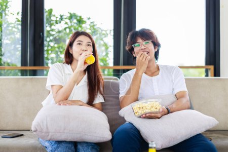 Photo for Married Life, Couple Relaxing and Watching a Movie in Their Living Room - Royalty Free Image