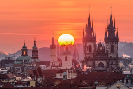 A rising sun above the Prague cityscape in spring.