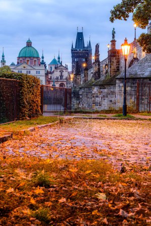 An autumn morning at the Charles Bridge in the historic center of Prague. 