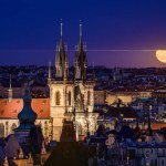 The rising super full moon over the Church of Our Lady before Tn in Prague. 