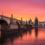 A pink and orange dawn at the Charles Bridge in Prague. 
