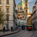 Prague, Czechia, April 2022 - A tram passing the street Karmelitska leading towards the St. Nicholas Church.