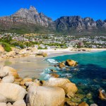 Camps Bay Beach with Twelve Apostles in the background in Cape Town.