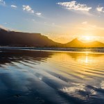 A beautiful sunset over the Table mountain in Cape Town from the Lagoon beach. 
