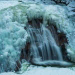 The frozen Mumlava waterfall in Krkonose national park in winter. 