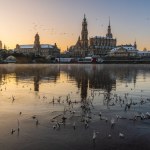 The historical waterfront of Elbe river with baroque buildings in Dresden early morning in the winter dawn. 