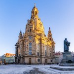 The Dresden Frauenkirche and the Luther Monument early in the winter morning light up by the morning sun.
