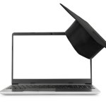 Laptop and mortar graduating hat on it isolated on white background. Online education concept