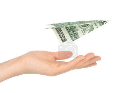Foto de Un billete de dólar de origami plano por encima de la mano femenina aislado sobre fondo blanco - Imagen libre de derechos