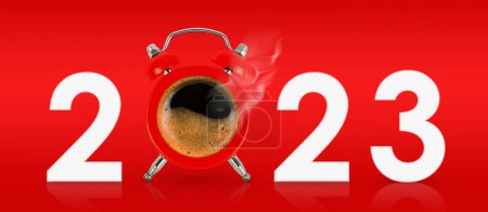 New Year 2023 concept. Alarm clock like cup of hot coffee with number 2023 on red background